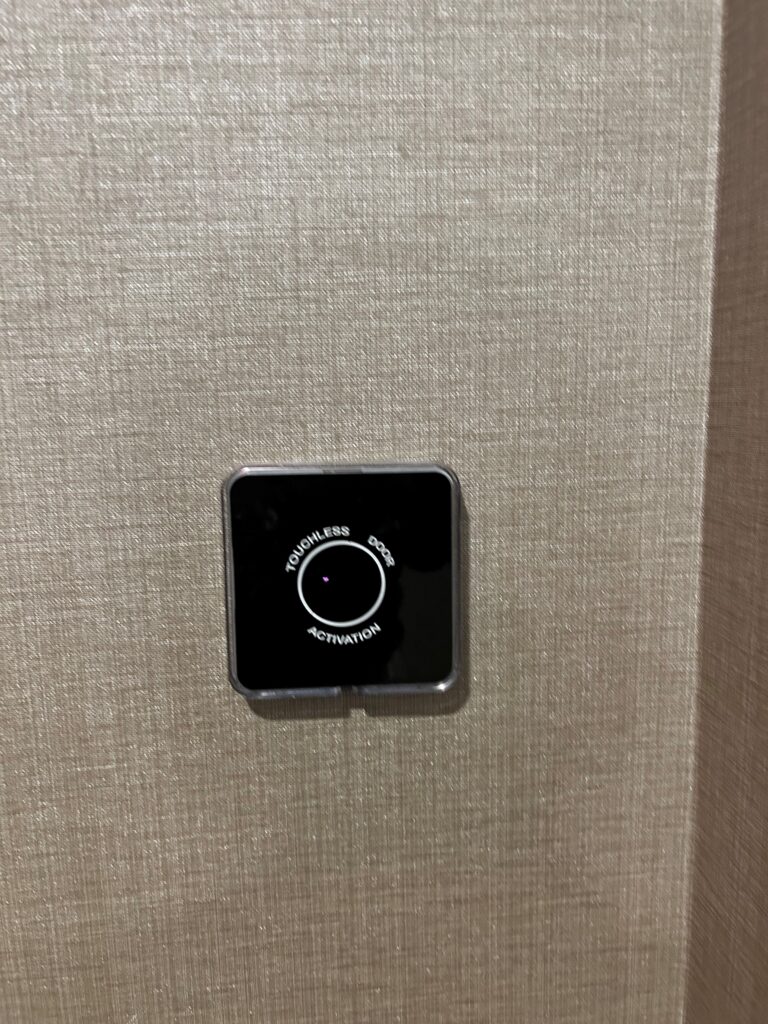 a black square button on a wall