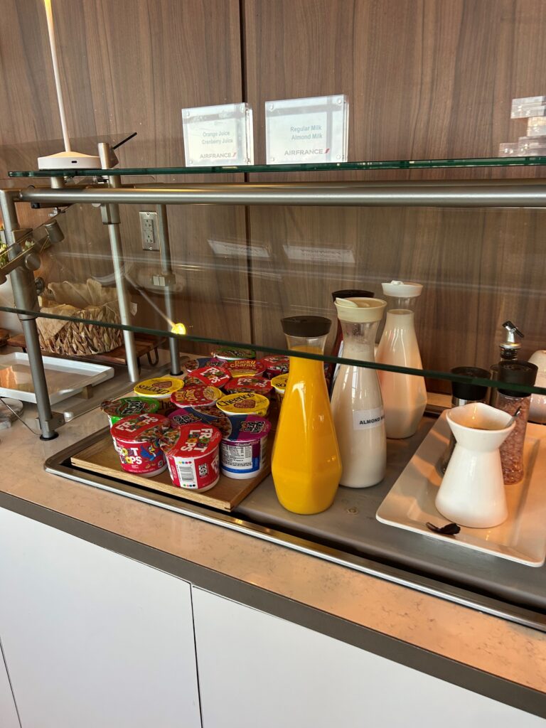a glass display case with different types of food on it