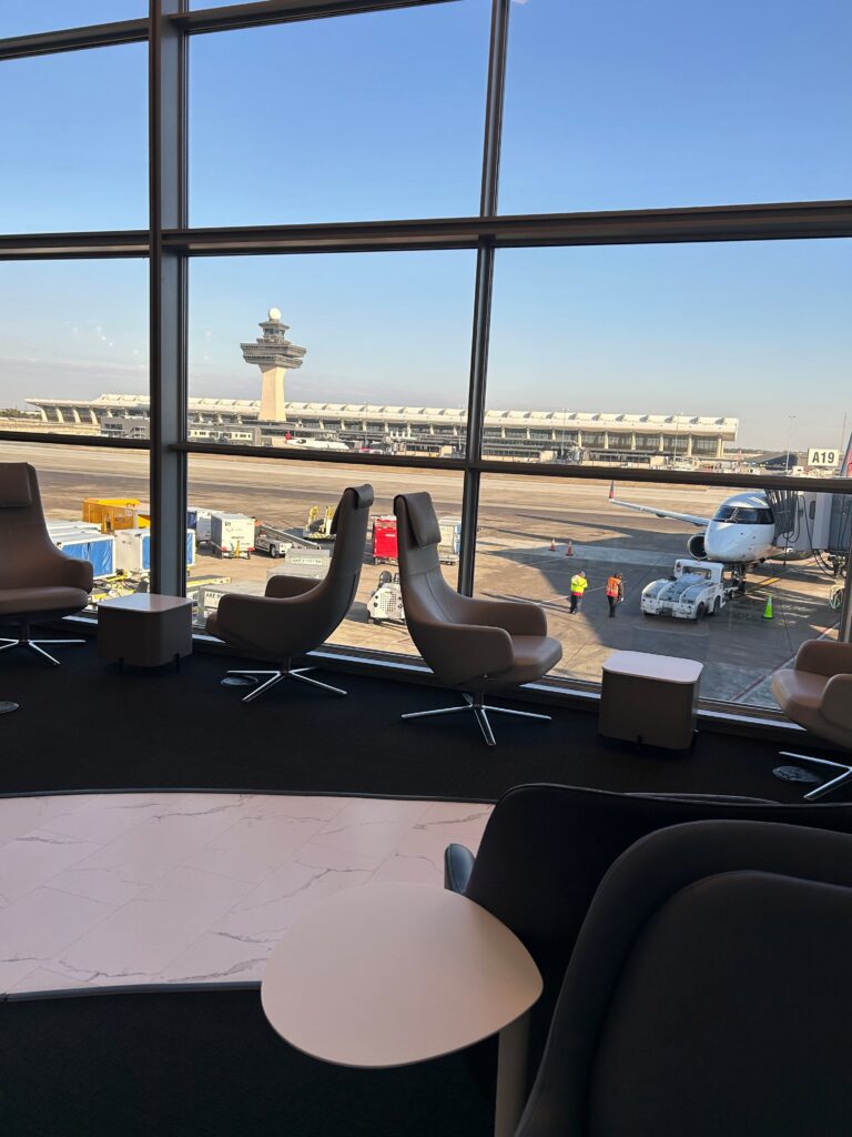 a room with chairs and a large window