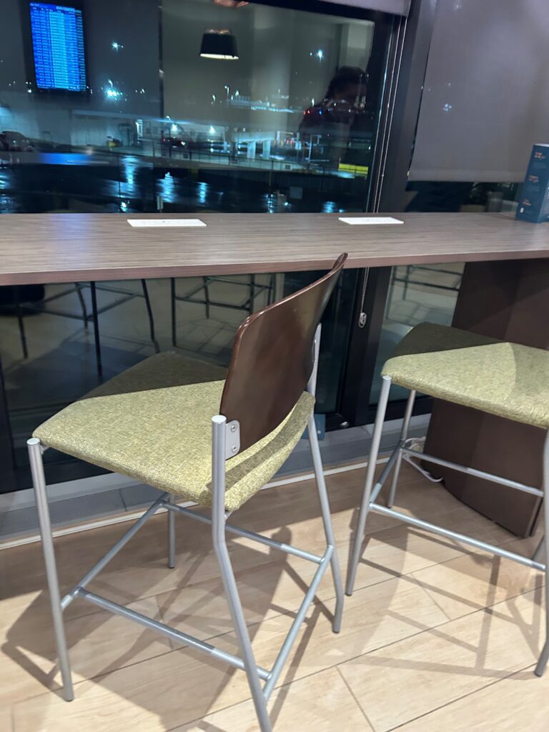 a chair and a table with a window