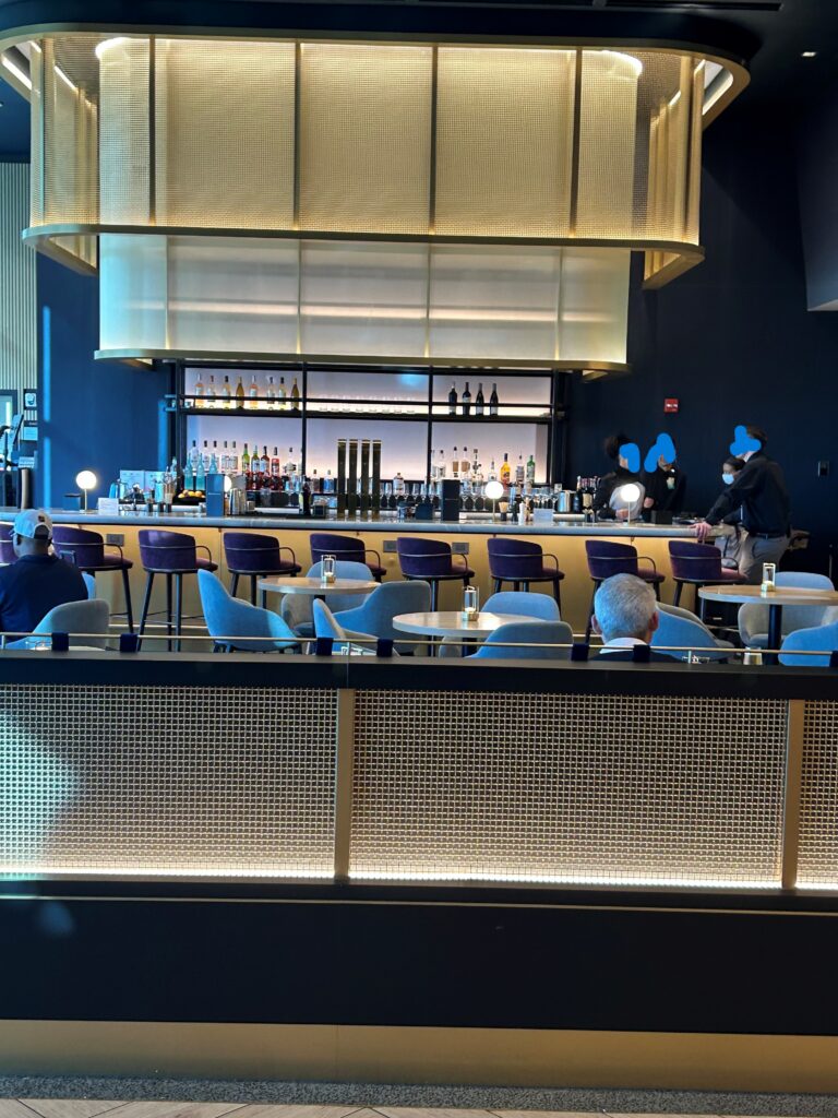 a bar with people sitting in chairs