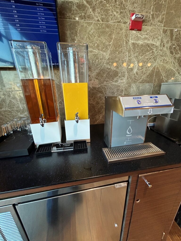 two large dispensers on a counter